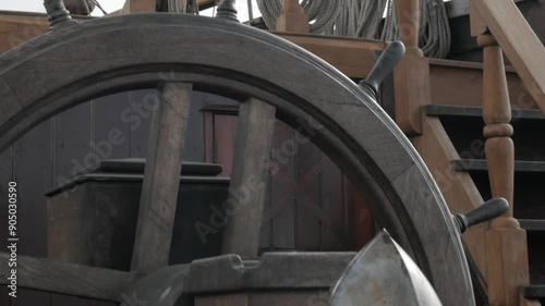 quarterdeck of an old Spanish sailing ship from the 18th century with a helmet and a sword