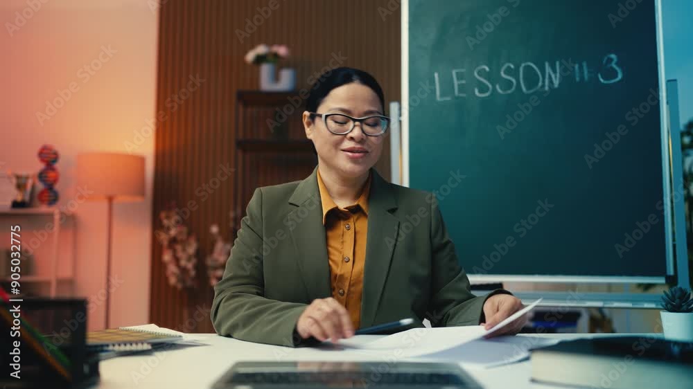 Asian woman teacher discussing good grades with students at online video lesson Asian woman teacher discussing good grades with students at online video lesson