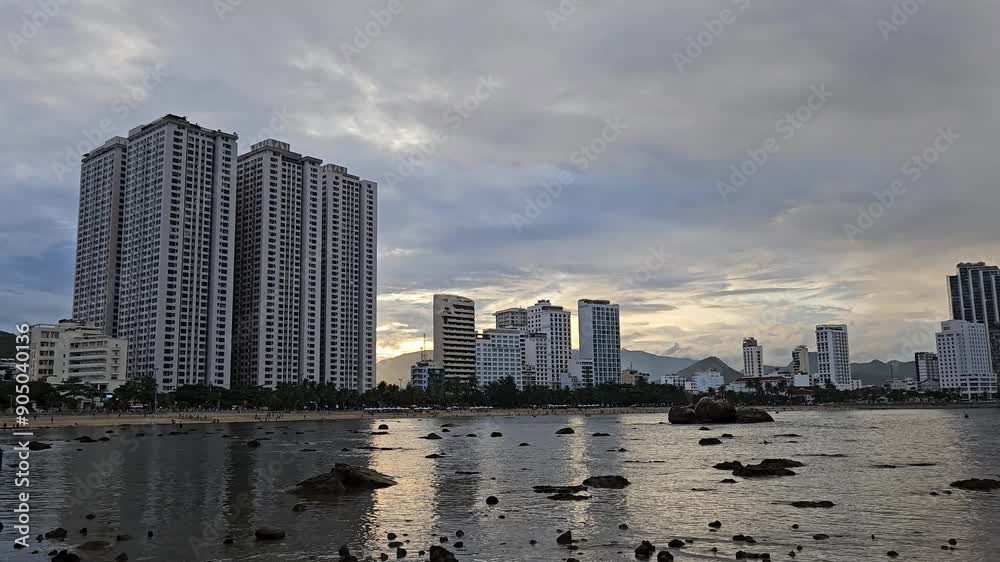 Beach and high-rise buildings in Nha Trang city, Vietnam in sunset. Beach and high-rise buildings in Nha Trang city, Vietnam in sunset.