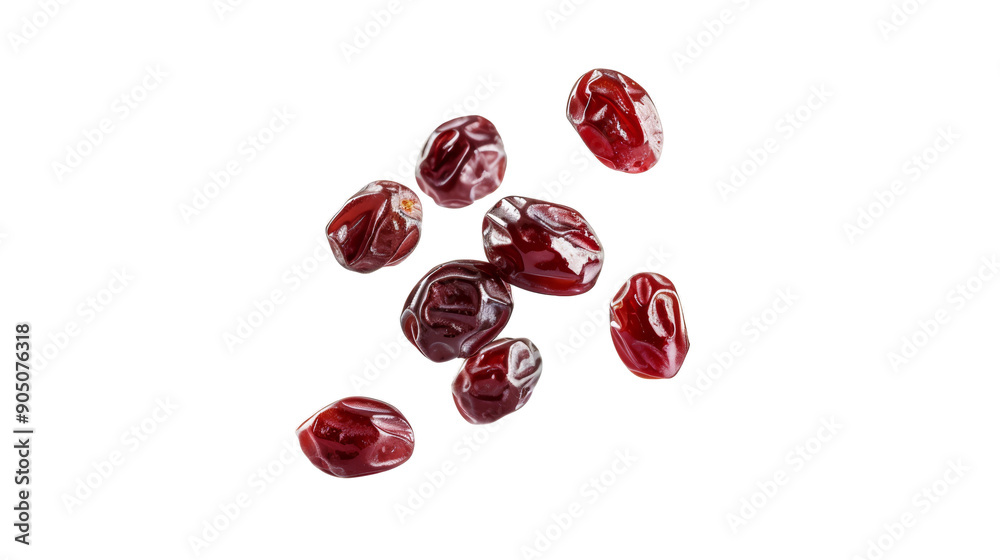 A bunch of red berries are scattered on a white background A bunch of red berries are scattered on a white background