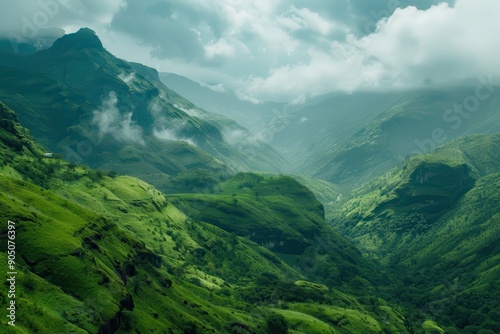 Rolling Green Hills and Mist-Covered Peaks in a Mountain Valley