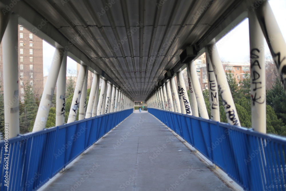 A bridge in the city of Madrid allows you to go from one neighborhood to another. working-class neighborhoods and graffitis A bridge in the city of Madrid allows you to go from one neighborhood to another. working-class neighborhoods and graffitis