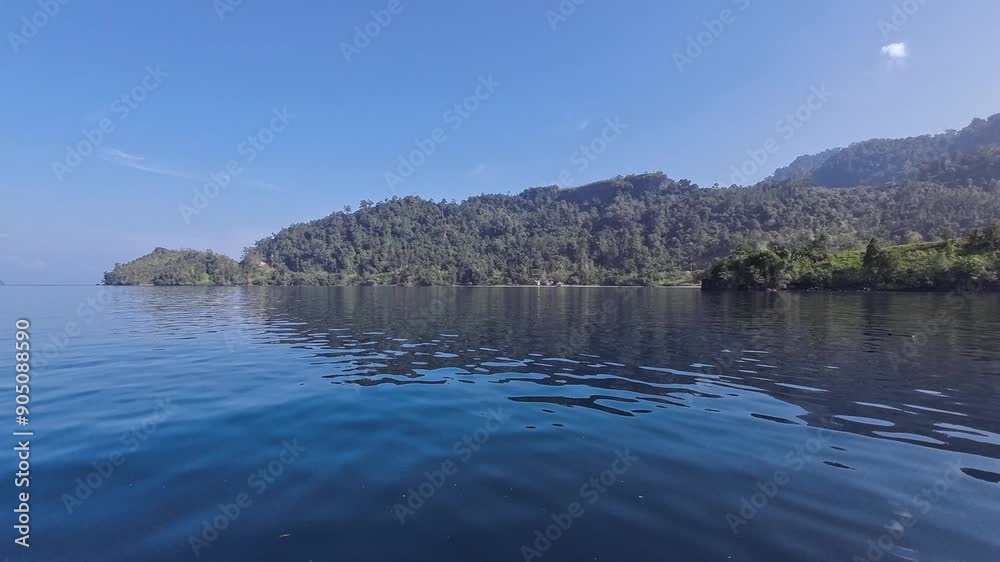 The hill, island, sea and hills. The sky is blue. Cubadak Island, Mandeh, Pesisir Selatan, Indonesia The hill, island, sea and hills. The sky is blue. Cubadak Island, Mandeh, Pesisir Selatan, Indonesia