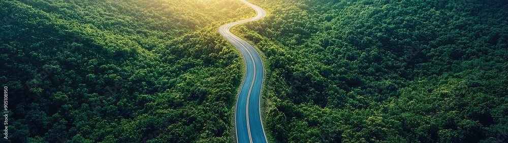 Aerial view asphalt road on the green forest, Curve asphalt road on mountain green forest, Countryside road passing green forest and mountain. Aerial view asphalt road on the green forest, Curve asphalt road on mountain green forest, Countryside road passing green forest and mountain.