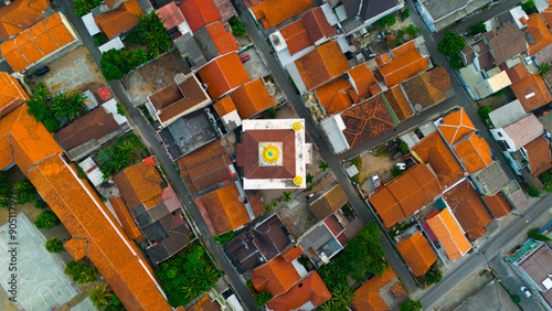 Aerial view showcasing the geometric beauty of a colorful urban neighborhood with a mosque at its heart