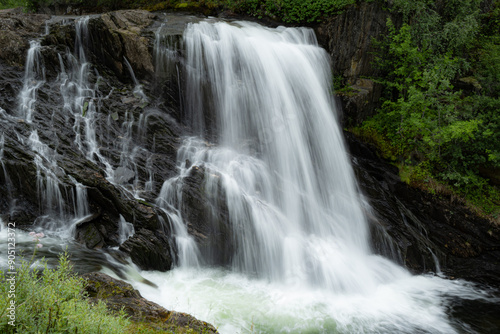 Small waterfall flowing over stones in the mountains of Rago, Northern Norway