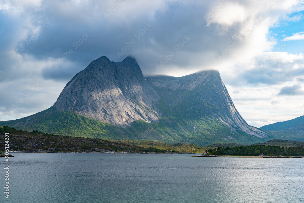 Nymoaksla mountain peak behind a fjord in Northern Norway Nymoaksla mountain peak behind a fjord in Northern Norway