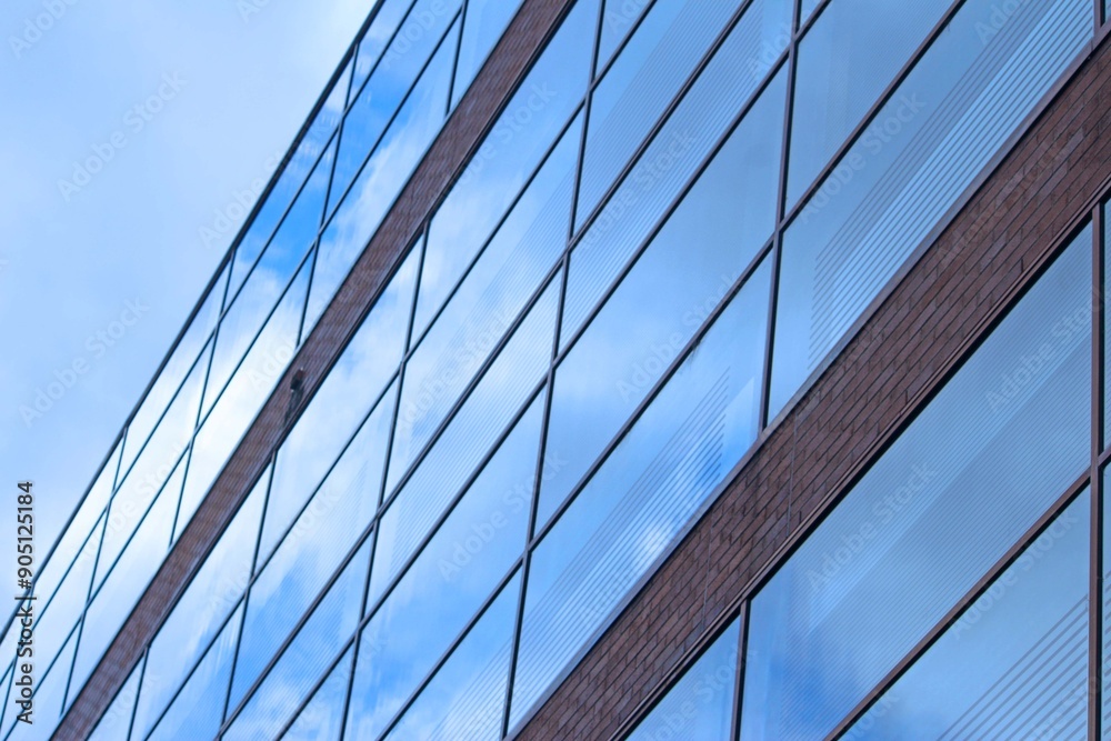 Glazed building with reflection of clouds in the glass Glazed building with reflection of clouds in the glass