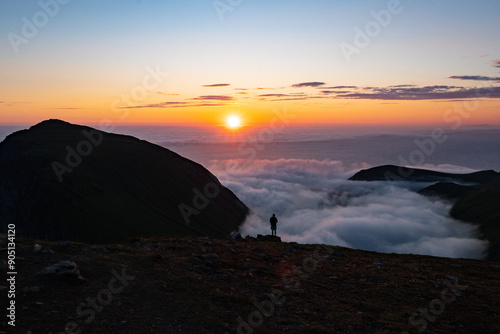 Sea of clouds at dramatic colorful evening sky during the midnight sun in the Lofoten, Northern Norway