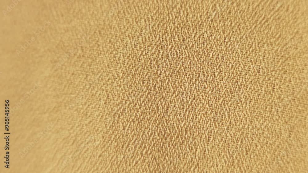 Texture of sand yellow color background from woven textile material, shaking, macro view Texture of sand yellow color background from woven textile material, shaking, macro view