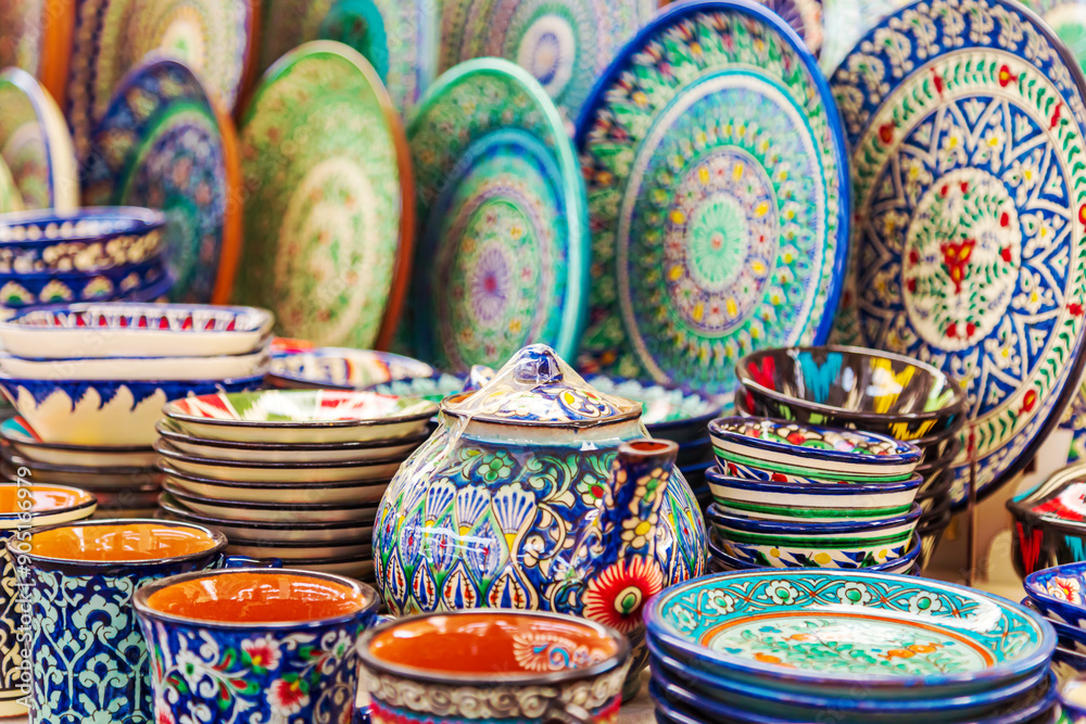 Fototapeta premium Multicolored ceramic dishes with oriental ornaments at the Siab Bazaar.