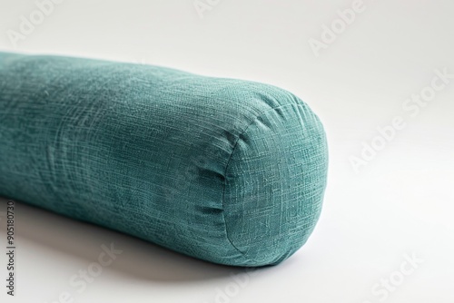 A person uses a yoga bolster to relax and unwind, surrounded by calming atmosphere. The bolster provides comfort and support for a peaceful meditation.