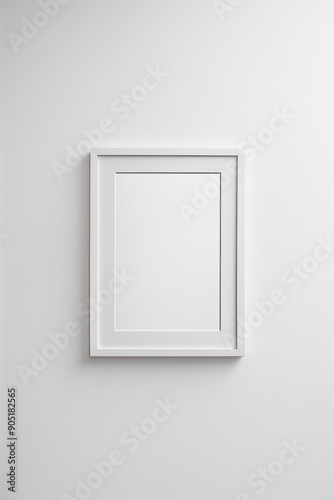 Minimalist white picture frame on a clean, white wall.