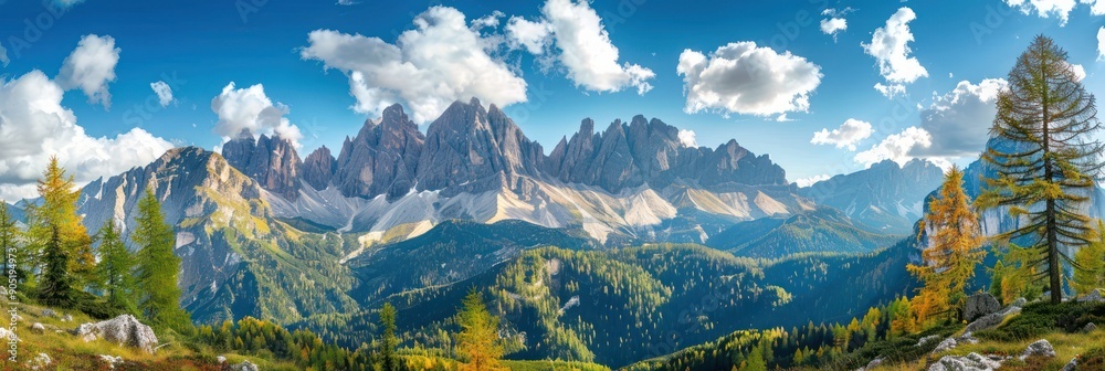 Obraz premium Breathtaking panoramic view of Italian Dolomites in autumn. Majestic mountains, colorful trees, blue sky and white clouds create a stunning landscape.