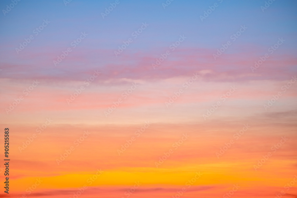 Fototapeta premium Beautiful , luxury soft gradient orange gold clouds and sunlight on the blue sky perfect for the background, take in everning,Twilight, Large size, high definition landscape photo