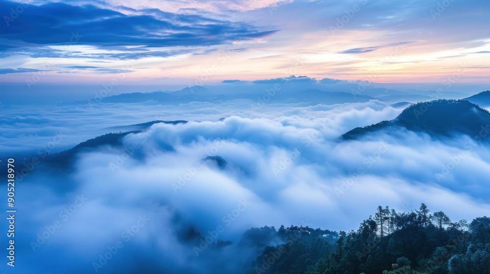Fototapeta premium Misty Mountain Sunrise with Silhouetted Peaks