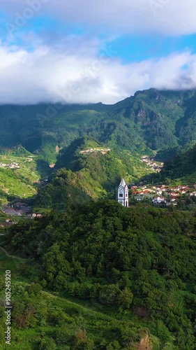 Wallpaper Mural Chapel of Our Lady of Fatima on Sunny Day. Green Valley and Mountains. Sao Vicente, Madeira, Portugal. Aerial Drone Shot. Moving Forward and Upwards. Vertical Video Torontodigital.ca