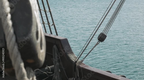 18th century wooden sailing ship deck shot and balustrade overlooking the Mediterranean Sea.