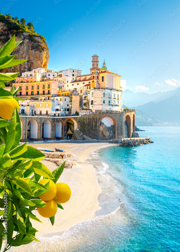 Beautiful view of Amalfi on the Mediterranean coast with lemons in the foreground, Italy