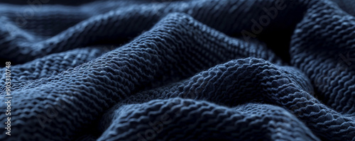 Navy blue textured backdrop with a soft, terry cloth-like surface, evoking comfort and warmth.