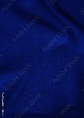 Dark blue velvet fabric background in a luxurious style