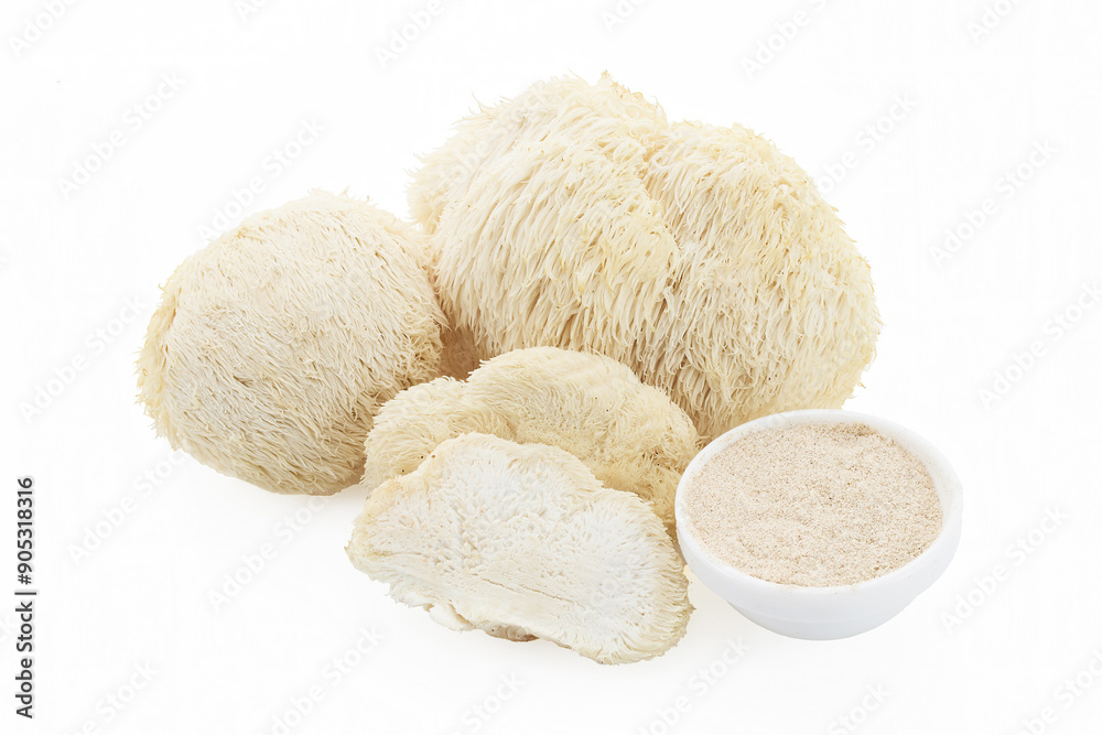 A collection of lion's mane mushrooms including whole and sliced pieces A collection of lion's mane mushrooms including whole and sliced pieces