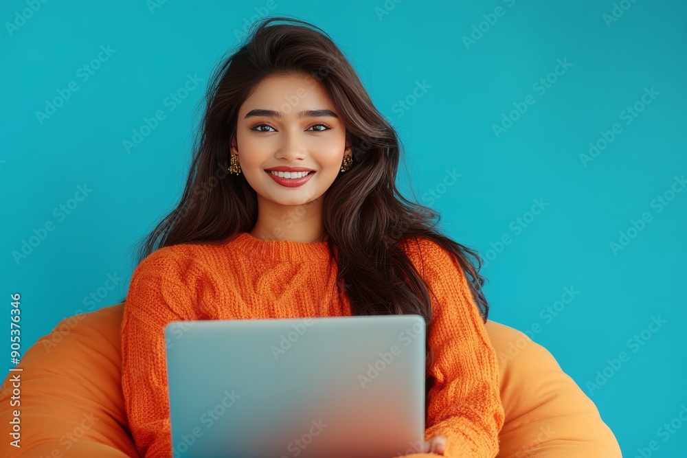 Positive Indian Woman on Video Call from Bean Bag Against Blue Background generative ai Positive Indian Woman on Video Call from Bean Bag Against Blue Background generative ai