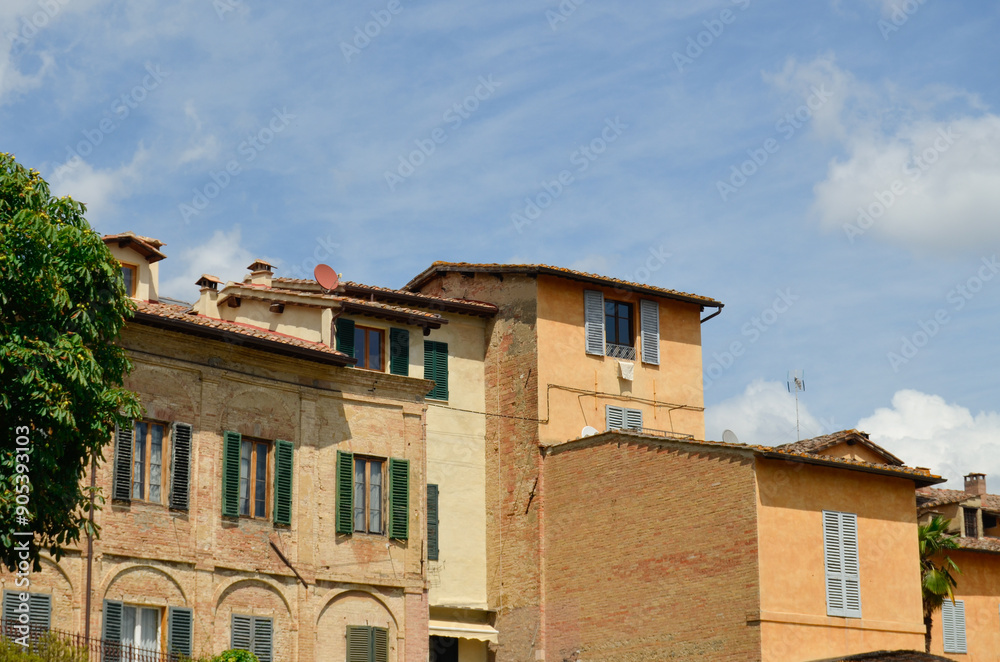 Tuscany row of houses in Italy with blue sky Tuscany row of houses in Italy with blue sky