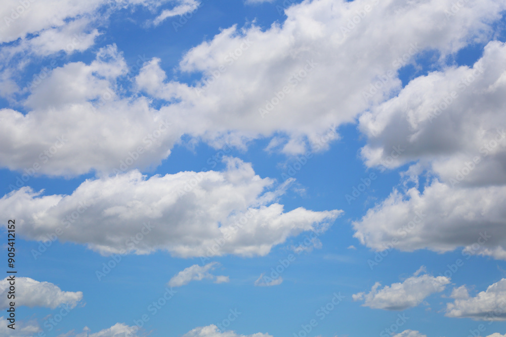 Blue sky with white clouds in the daytime background. Blue sky with white clouds in the daytime background.