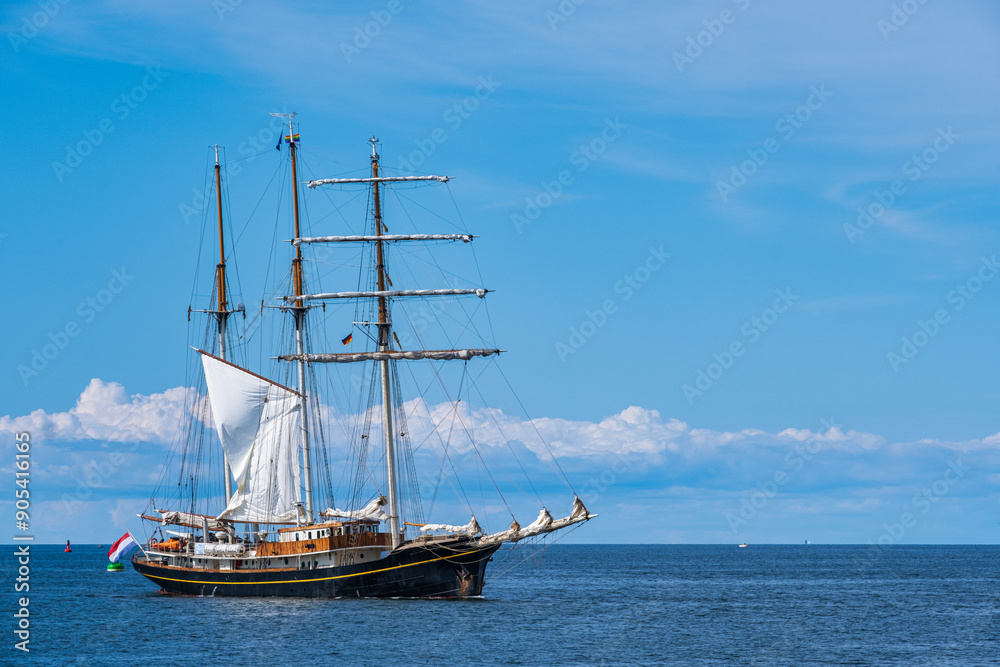 A magnificent older sailing ship shortly before entering the port of Warnemünde A magnificent older sailing ship shortly before entering the port of Warnemünde