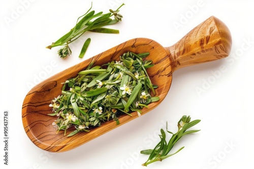 Top view of a wooden scoop filled with organic crabgrass flowers on white background photo