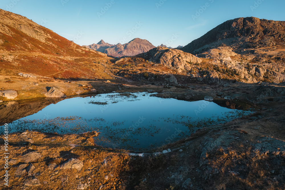 Landscape of sunrise shine over Lac Guichard with rocky mountain in autumn at France