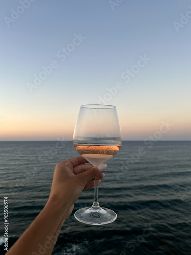 Glass of rose at sunset photo