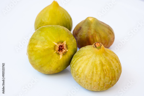 Figs isolated on white background .Green ripe sweet figs. Healthy Mediterranean fig fruit.
