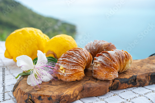 Italian desssert, Naples sfogliatella, shell-shaped layered pastry, with sweet custard-like filling made with semolina, ricotta, and candied citrus fruit photo