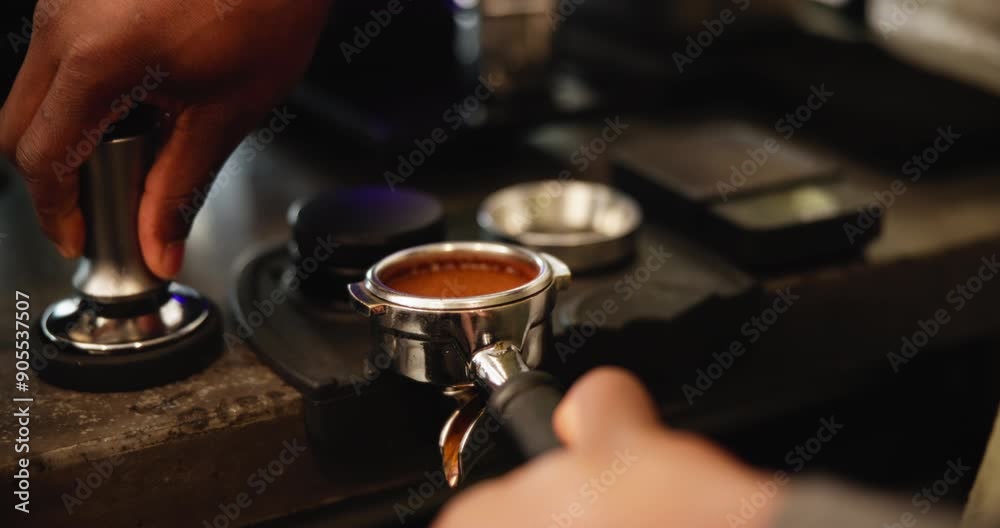 Coffee, tamper and hands of person with ground beans for premium drink at small business restaurant. Machine, tools and barista pressing espresso powder in filter for morning brew in cafe service Coffee, tamper and hands of person with ground beans for premium drink at small business restaurant. Machine, tools and barista pressing espresso powder in filter for morning brew in cafe service