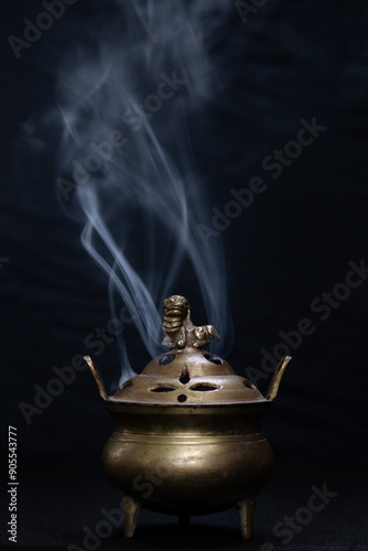 Incense burning in a brass lamp