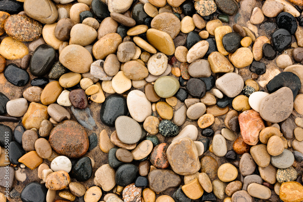 Numerous small stones compliments of Lake Michigan along the beach at Kohler Andrae State Park, Sheboygan, Wisconsin in early June Numerous small stones compliments of Lake Michigan along the beach at Kohler Andrae State Park, Sheboygan, Wisconsin in early June