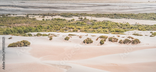 Sandy desert with dunes in Tien Shan mountains on Pamir Highway in Tajikistan against the backdrop of mountain rocky peaks and Panj River in Wakhan Valley, mountain landscape for background photo