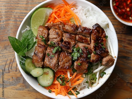 Bun Thit Nuong. The most popular Vietnamese dishes. Grilled pork served over vermicelli noodles with fresh vegetables and a fish sauce dressing.