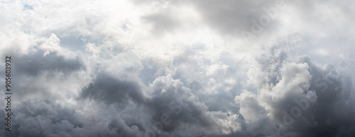 Fotografie Gray thick rain clouds in the autumn sky