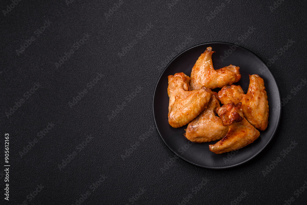 Delicious fried chicken wings with salt, spices and herbs