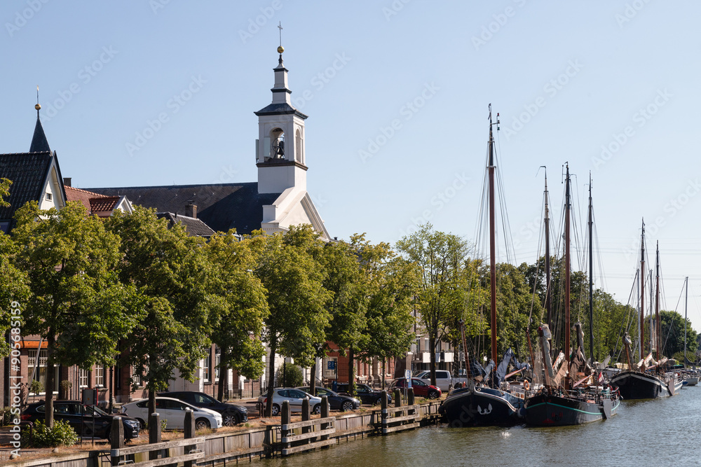Holy Nicholas Church - H. Nicolaaskerk, along the harbor in the picturesque Dutch town of Muiden. Holy Nicholas Church - H. Nicolaaskerk, along the harbor in the picturesque Dutch town of Muiden.