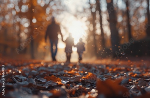 Family Walk During Autumn Sunset in a Leaf-Covered Trail