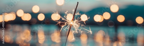 Sparkler Glowing Bright Against Sunset Over Water