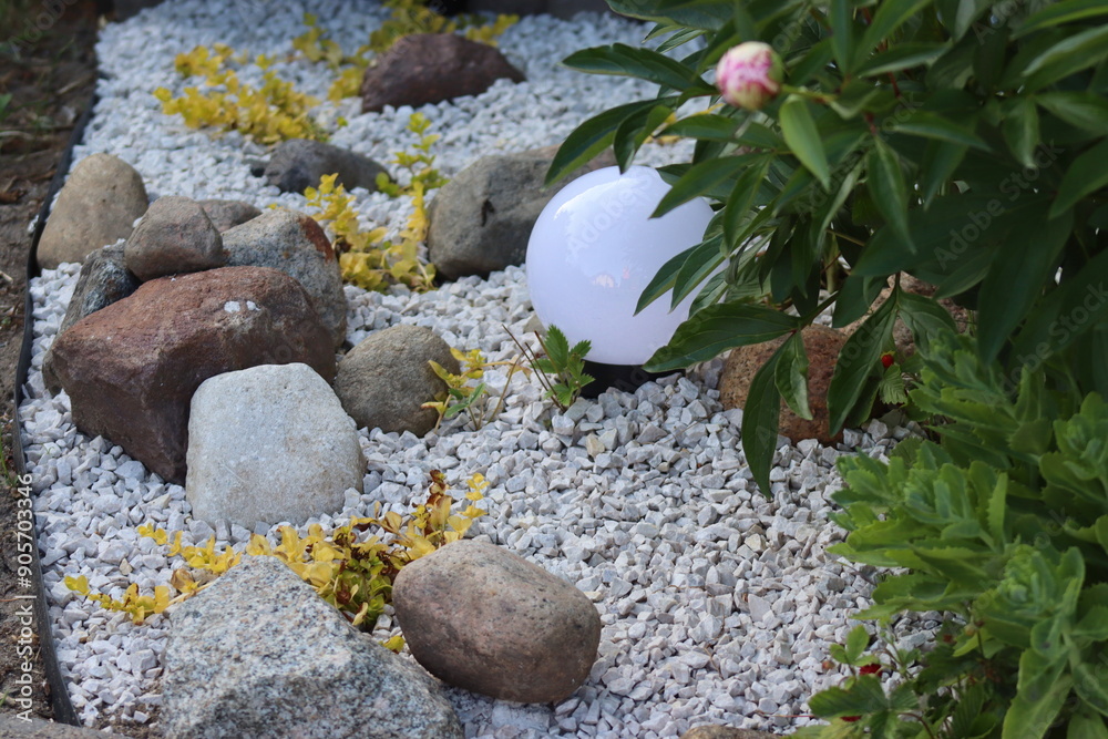 Decorative stones in the garden. Ornamental plants. Decorative stones in the garden. Ornamental plants.