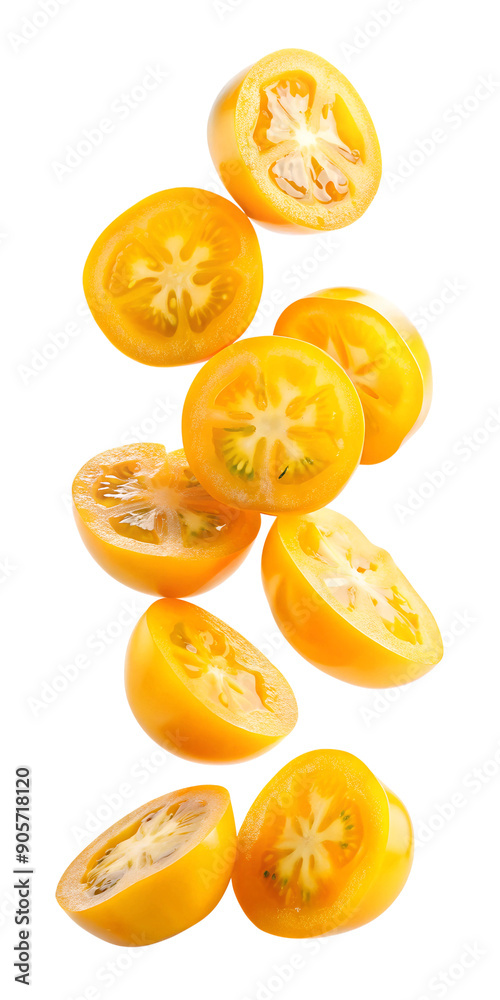 Falling sliced yellow tomatoes on isolated background Falling sliced yellow tomatoes on isolated background
