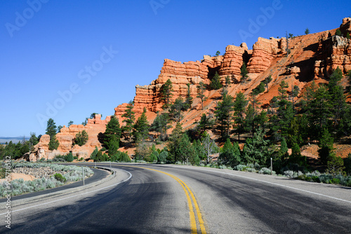 Highway 12 passing through Red Canyon with colorful cliff and trees in Utah photo