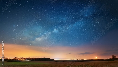 night starry sky with glowing stars above countryside field landscape in early spring bright glow of planet venus in sky among the stars sky in warm lights of evening sunset dawn or morning sunrise