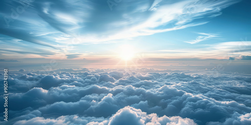 Beautiful view from the airplane window flying above the clouds blue sky in sunny day and soft sunlight in the afternoon.  photo